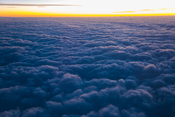 China Shanghai - Sunrise above the clouds from the plane
