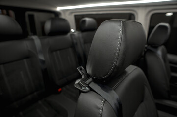 Comfortable interior of a passenger bus with soft seats. The design is made to order. Private covering of cars. Various elements of the bus interior.