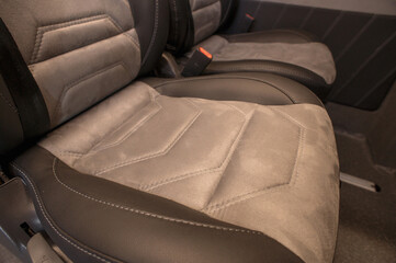 Comfortable interior of a passenger bus with soft seats. The design is made to order. Private...