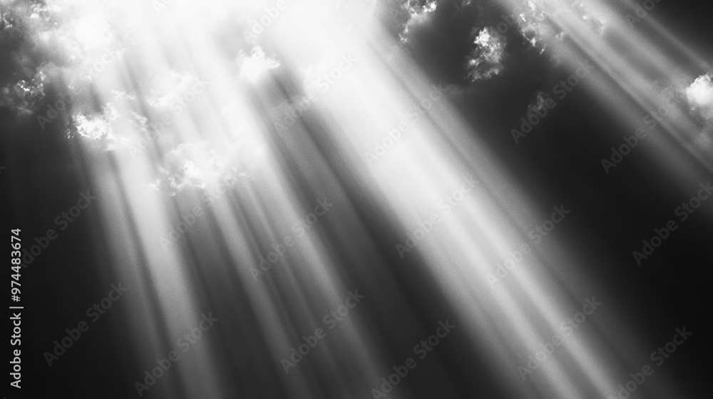 Poster sun rays breaking through dramatic clouds in a black and white sky, creating a striking contrast of 
