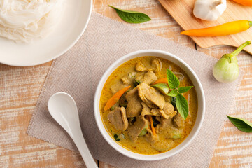 Green Curry with duck meat.Thai sliced duck breast with green curry paste and coconut milk in white bowl ,thai food ,Gaeng Kiew Wan.Top view.