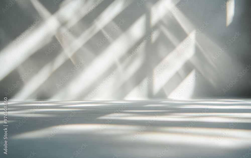 Poster abstract light and shadow patterns on a white wall creating a minimalist and tranquil atmosphere.