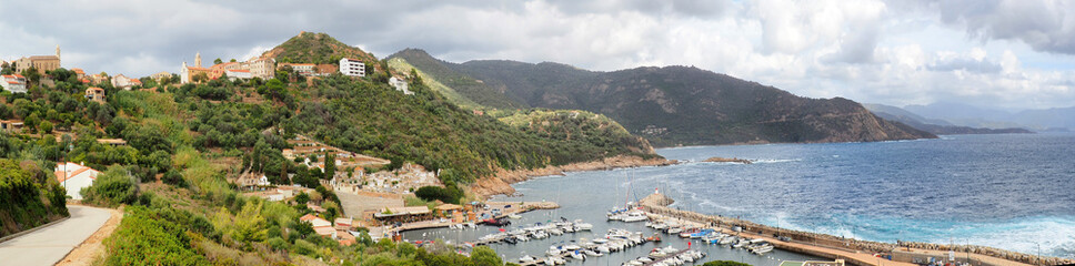 Naklejka premium Panoramic view of Cargèse, a village on the west coast of Corsica, built on a promontory facing the sea. An ancient Greek city, the village is dominated by two churches, one Latin, the other Orthodox