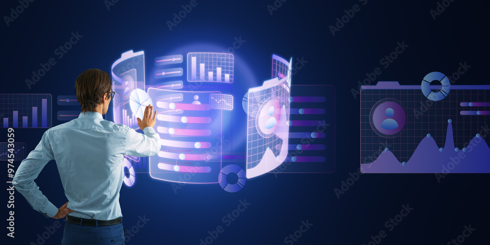 Leinwandbilder businessman interacting with a virtual digital interface of charts and graphs on a dark background.