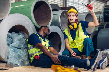 First aid support accident at work of worker at factory. Male worker has an accident on the floor...