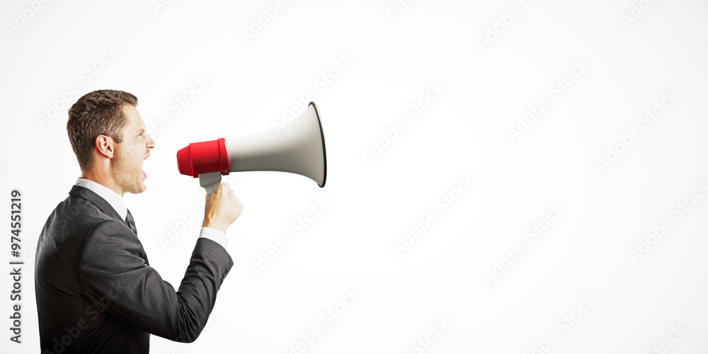 Poster businessman in suit shouting into a megaphone on a clean white background. the image represents comm