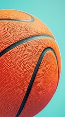Obraz premium Close-up of a basketball on a blue background, sports equipment concept