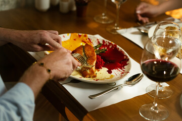 Man Savors His Fish Dish at Dinner