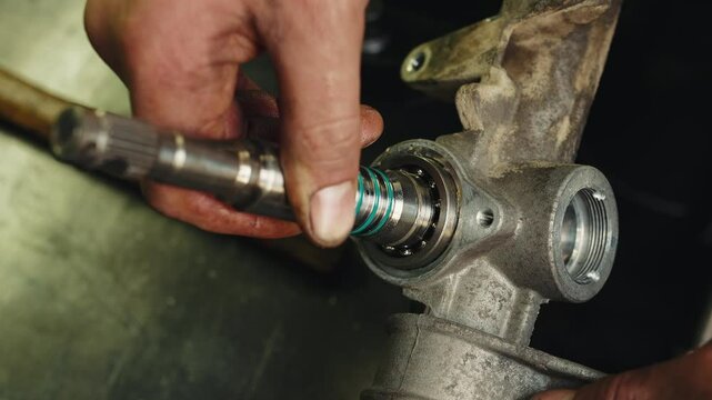 Worker mechanic apply dense grease lubricant to a steering rack and repair process of steering rack