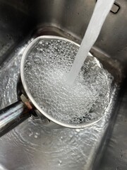 pouring water into glass