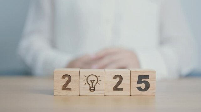 2024 year change to 2025 year block with lightbulb. Business Idea, Creative, Thinking, brainstorm, Goal, Resolution, strategy, plan, Action, change and New Year start concepts