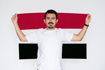Moustached man holding Yemen flag, independence or celebration day idea, campaigning concept
