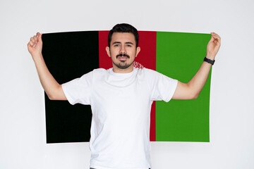 Moustached man holding Afghanistan flag, protest or social issues in Afghanistan, campaigning 