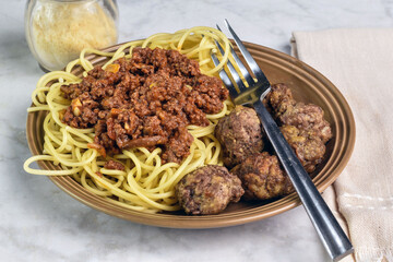 spaghetti and meat sauce   with a side of meat balls
