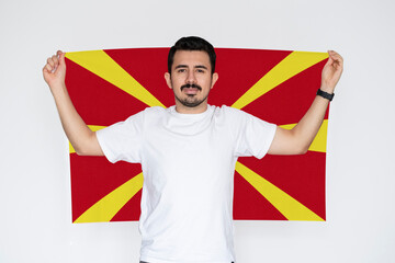 Moustached man holding Macedonia flag, campaigning concept, patriot and nationalist person