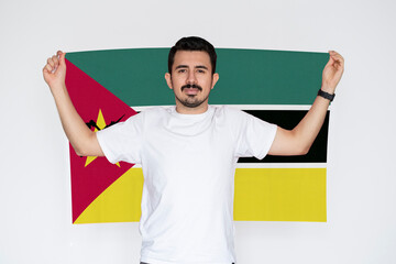 Moustached man holding Mozambique flag, patriot and nationalist person, protest or social issues 