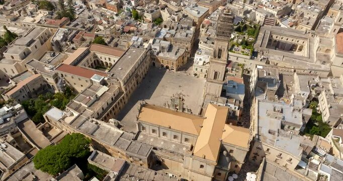 Aerial view of the cathedral of Lecce, in Apulia, Italy. The metropolitan cathedral of Santa Maria Assunta with its tall bell tower is located in Piazza del Duomo, in the historic center of the city.