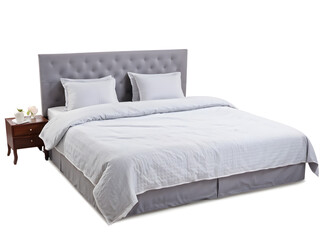 Comfortable gray bed with linens on white background
