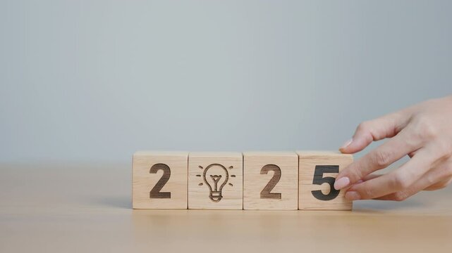 2024 year change to 2025 year block with lightbulb. Business Idea, Creative, Thinking, brainstorm, Goal, Resolution, strategy, plan, Action, change and New Year start concepts
