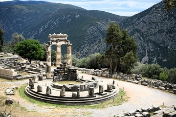 Stone remains of a tholos, a sacred circular building with columns in the sanctuary of Athena...
