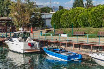 Two boats at the pier of the yacht club 