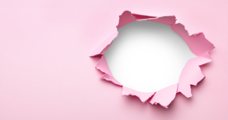 Torn pink paper peels away to expose a smooth white or PNG transparent area