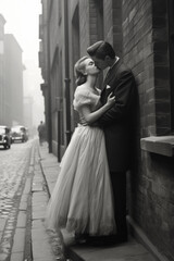 A romantic black-and-white vintage moment as a couple kisses passionately on a foggy cobblestone street, leaning against a brick wall, exuding timeless love and nostalgia.