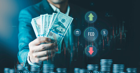  Fed rate hike concept, world economics and inflation control, Businessman holding US dollars...