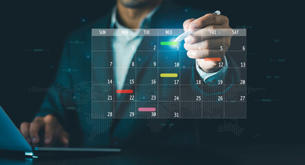 Business Planning Calendar Agenda work schedule concept, Businessman use pen marks on virtual...