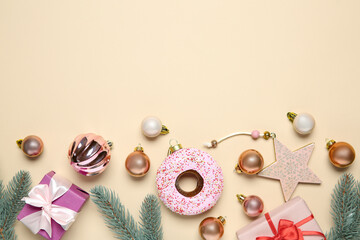 Flat lay composition with Christmas decor and gift boxes on beige background. Space for text