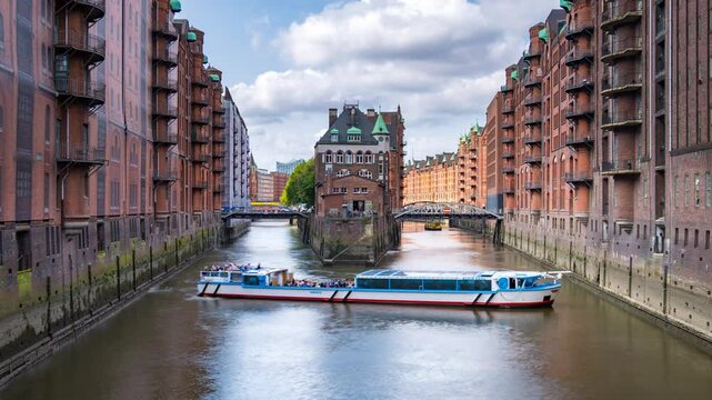 Hamburg city Germany. View of Speicherstadt in Hamburg, Germany. Time-lapse with illuminated historical buildings at sunset with reflection 4K.