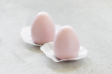 Strawberry cream mousse dessert egg. On a plate. Close-up