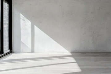 Obraz premium Empty room interiors in neutral tones with a mix of natural window lighting and shadows. Property interior with no furniture or decor.