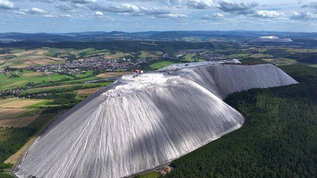White Spoil Tip in Germany - Aerial view of a mining waste disposal that causes ecological damage. A Huge Pile of Rock.