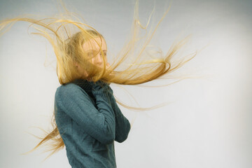 Sad girl with blowing hair