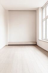 Fototapeta premium Empty room interiors in warm tones with a mix of natural window lighting and shadows. Minimalist apartment interior