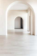 Fototapeta premium Empty room interiors in warm tones with a mix of natural window lighting and shadows. Minimalist apartment interior
