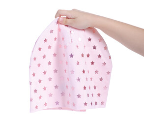 Children's pink warm autumn hat on the head in female hand on white background isolation