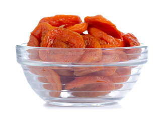 Glass bowl with dry apricots on white background isolation