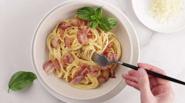 pasta spaghetti take off by frok in bowl on light sutgface