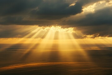 Golden Sunset Rays Through Clouds Over Field