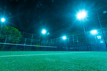 Padel court with lights and net outdoor. Night photo. Open tour poster for social media promotion...