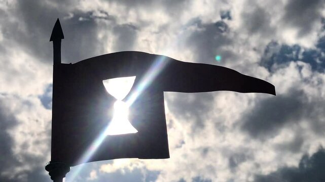 A pennant with a chalice as symbol of Hussite, against the sun rays