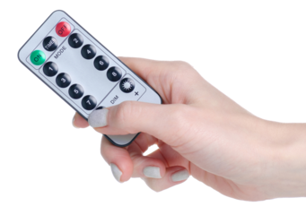 Small remote control in hand isolation