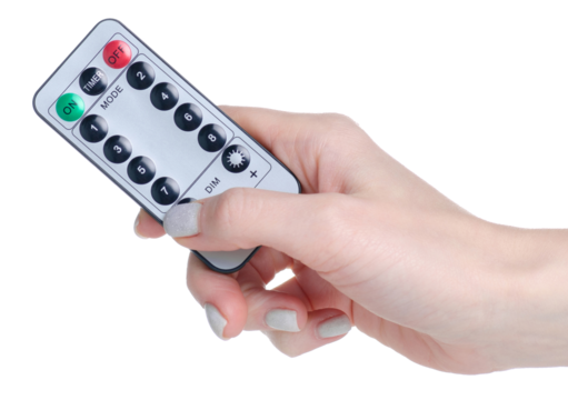 Small remote control in hand isolation