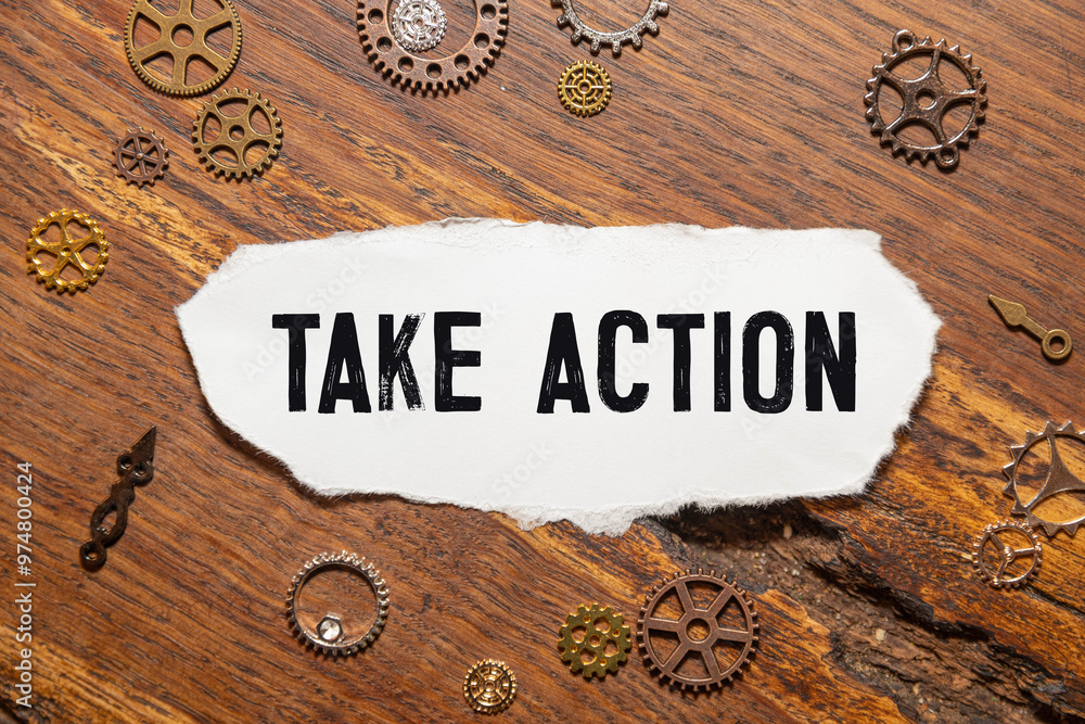 Poster notepad on the desktop. text take action