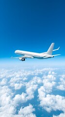 Obraz premium An airplane flying high above the clouds, symbolizing the adventure of international travel, against a clear blue sky