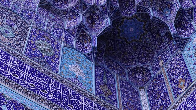 Ceiling at Imam Mosque, arch at the entrance, Naghsh-e Jahan Square, Isfahan, Iran. Beautiful oldest iranian mosque interior design. Unique mosaics and ornaments. A masterpiece of Persian architecture