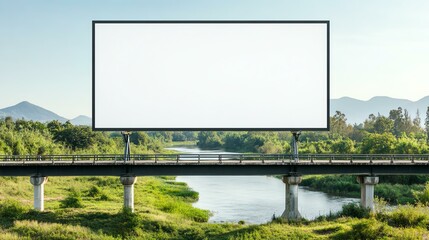 Obraz premium An empty billboard stands over a tranquil river, surrounded by lush greenery and mountains in a serene landscape.
