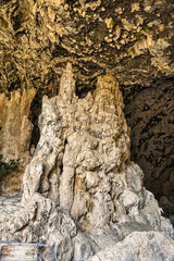Cave interior with visible effects of karst processes like stalagmite and stalactite